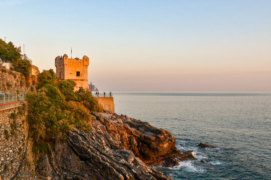 Torre Groppallo, a defensive construction against attacks by Turkish pirates of Dragut (16th century), on the Anita Garibaldi Promenade at sunset, Nervi, Genoa, Liguria,