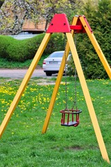 swing in the playground - obrazy, fototapety, plakaty