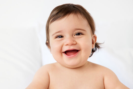 Laughing portrait of chubby baby boy