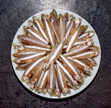 Raw fish,A manjuba, pititinga, ginga or manjubinha (Anchoviella lepidentostole), tropical freshwater fish. Top view