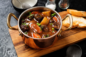 Irish stew made with beef, potatoes, carrots and herbs. Traditional St patrick's day dish. Black...