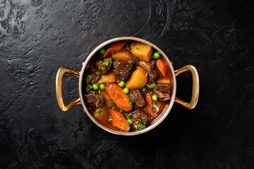 Irish stew made with beef, potatoes, carrots and herbs. Traditional St patrick's day dish. Black...