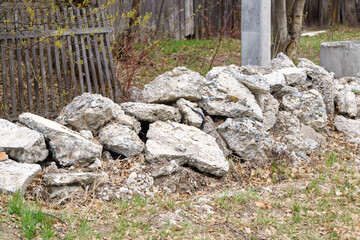 Pile of stones on the ground construction, a destructive pile, a destroyed road, and then dumped on the ground