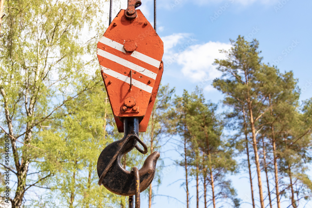 Poster crane hook for lifting loads. lifting device for stacking cargo. lifting and moving heavy loads on a