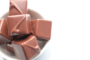Assortment of chocolate candies sweets isolated on a white background