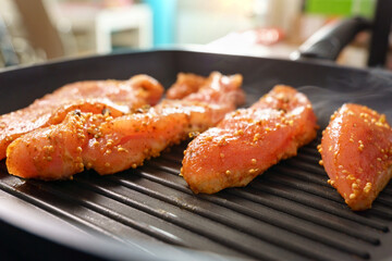 Cooking turkey steaks with spices on a grill pan. Healthy food. Weight loss and fitness. Selective focus.