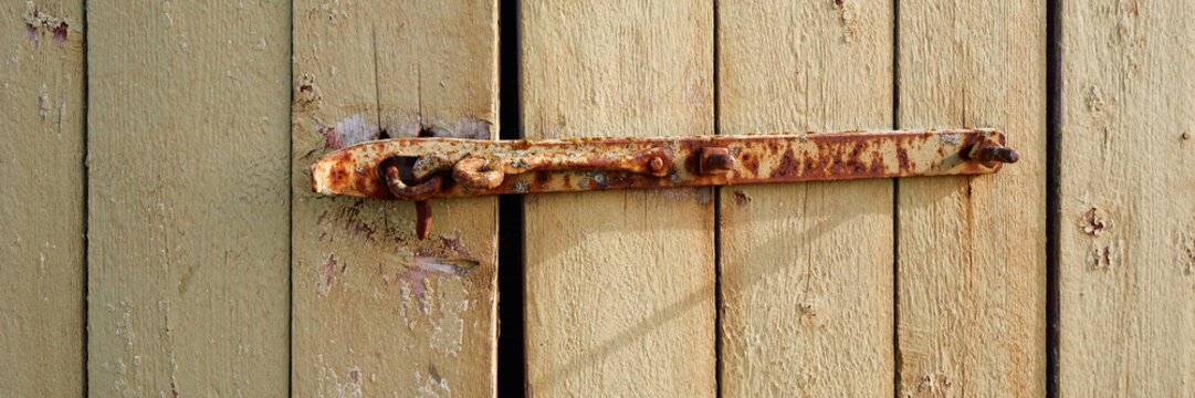 old rusty lock on a barn gate