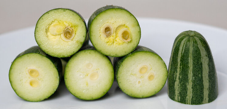 pointed gourd potol green vegetable on white background