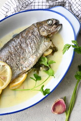 Baked trout in a butter-lemon sauce