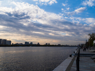 View of the city with clouds from the river