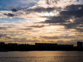 Picturesque View of the city on the river, Against The Sky During Sunset