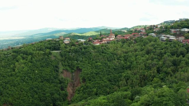 Aerial view to Sighnaghi city - georgian town Signagi in Georgia's easternmost region of Kakheti. Sighnaghi is a popular tourist destination in Georgia. Alazani valley in Georgia.