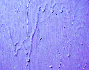 Wall with old paint with streaks.