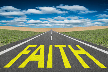 The word Faith written on a road of a spiritual journey.
