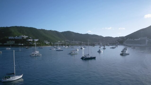 Drone video of sailboats and cruise ship in port, aerial view from harbor of Charlotte Amalie, Saint Thomas, US Virgin Islands
