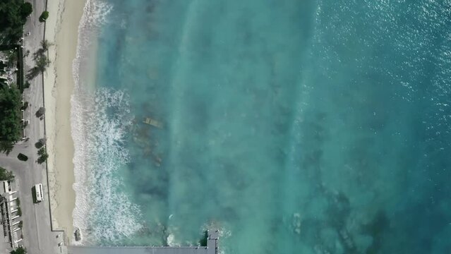 High angle overhead aerial footage of pier and seashore, drone view, Cockburn Town, Grand Turk, Turks and Caicos
