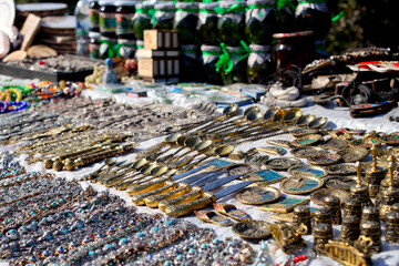 Souvenir stall. Street shop with handmade spoons, bracelets and beads.