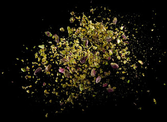 Crushed and whole kernels raw pistachio explosion - 504648646
