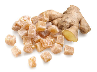 Pile of candied ginger cubes and a raw ginger root on white background