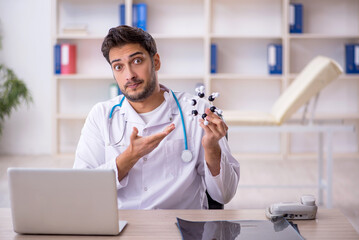 Young male doctor working in the clinic