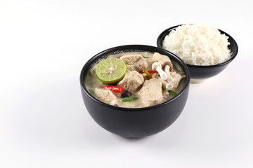 Tom Kha Gai. Thai chicken coconut soup in a bowl and rice in a bowl. isolated on a white background top view have copy space.