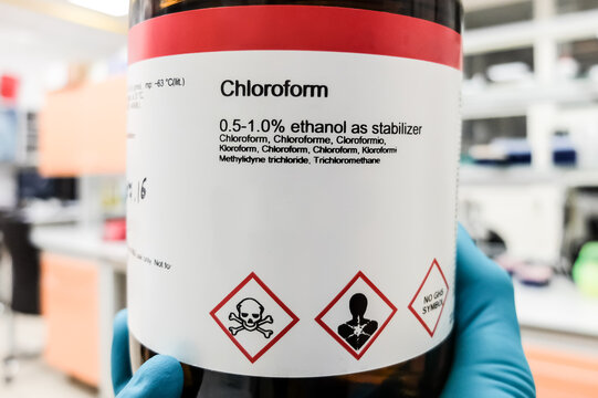 A bottle of chloroform. Appropriate safety symbols are visible on the label.