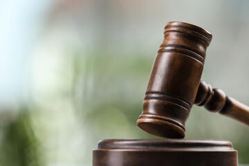 Wooden gavel on blurred background. closeup. Space for text