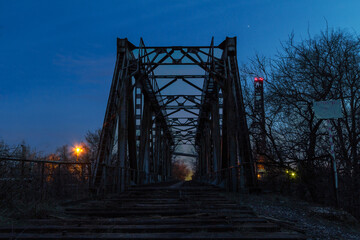 Abandoned railway bridge in the industrial area of ​​the iron ore mine	