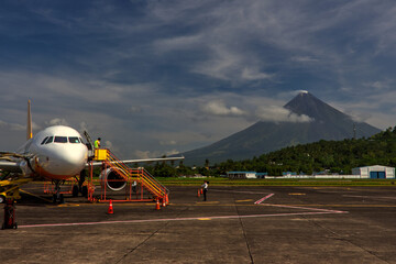 An aeroplane at Legazpi airport with the view of Mayon Vulcano in the background
