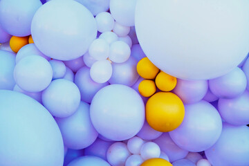 balls of blue or purple color, composition on the wall at a presentation or holiday 
