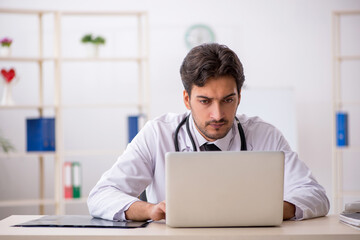 Young male doctor in telemedicine concept
