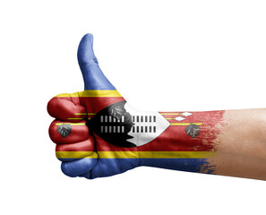 Hand making thumb up painted with flag of eswatini