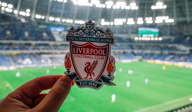 September 12, 2021, Liverpool, UK. Liverpool F.C. Football Club emblem against the backdrop of a modern stadium.