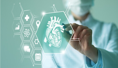 Unrecognizable female doctor holding graphic virtual visualization model of  Heart organ in hands. Multiple virtual medical icons.