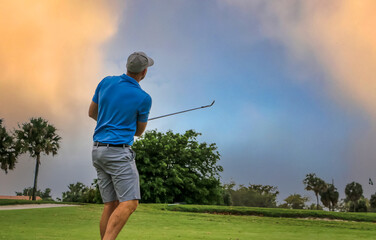 golfer chipping onto the green