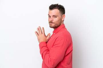 Young Brazilian man isolated on white background scheming something