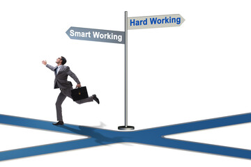 Businessman at the crossroads on working smart or hard