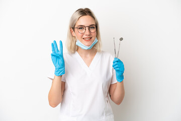 Dentist caucasian woman holding tools isolated on white background happy and counting three with fingers