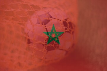 Morocco flag with Soccer ball in goal as background, sport and success business concept.