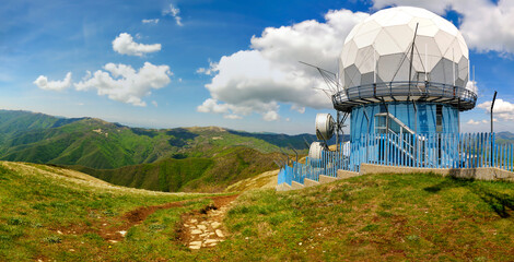 View of the Lesima Peak (Lombardy, Northern Italy), with its aviation balloon-shaped radar; is a...