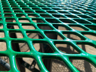 plastic coated mesh picnic table green park protective park perforated eating community play closeup party