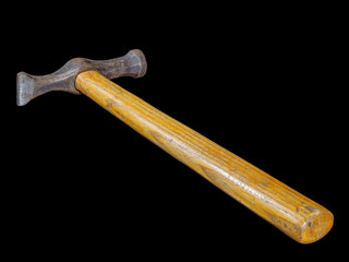 Used rusty hammer with wooden handle isolated on black background