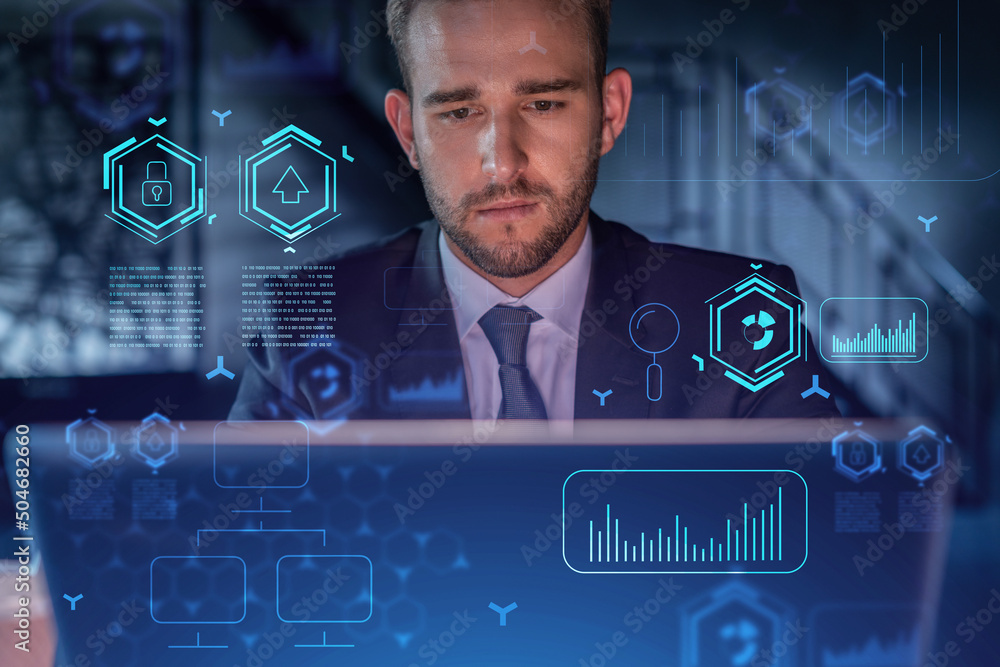 Aufkleber handsome businessman in suit at workplace working with laptop to optimize development by implying ne