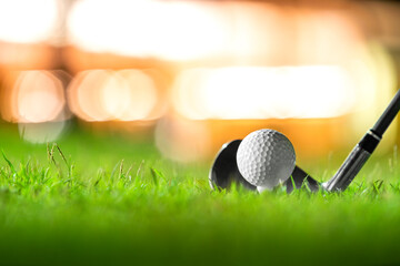 golf ball on tee in beautiful grass in golf course for shot to hole in one in competition with iron...