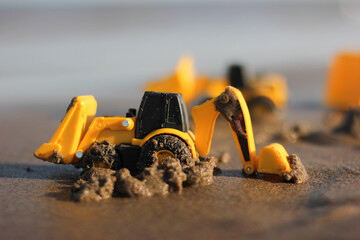 Child's plastic toys for outdoor play on the sand of the beach.