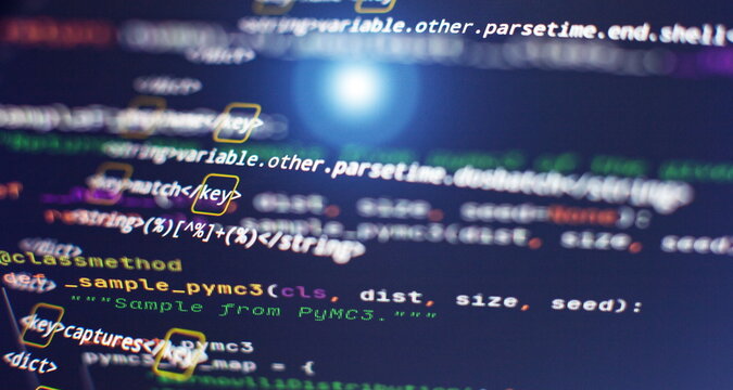 Website HTML Code on the Laptop Display Closeup Photo. Modern tech. Innovative startup project.