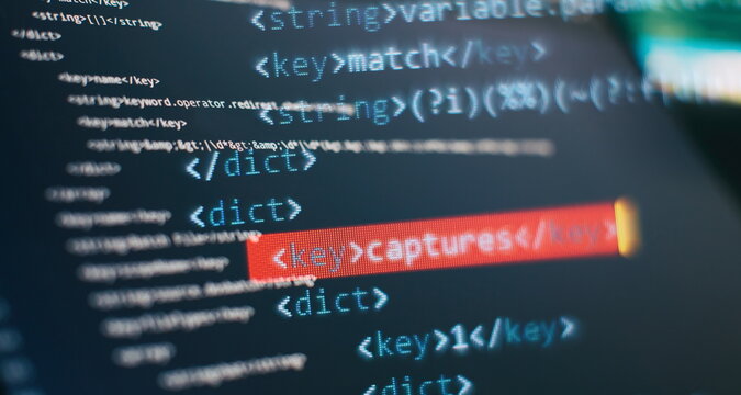 Website HTML Code on the Laptop Display Closeup Photo. Modern tech. Innovative startup project.