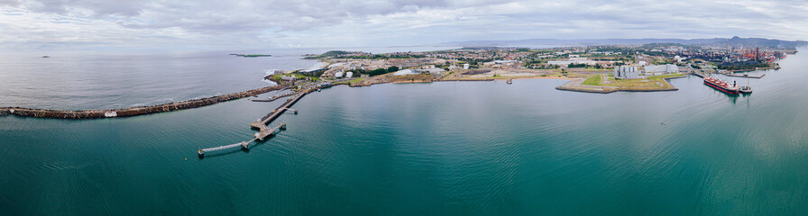 Aerial drone panoramic view of Port Kembla, in the Illawarra Region of NSW, showing the seaport,...