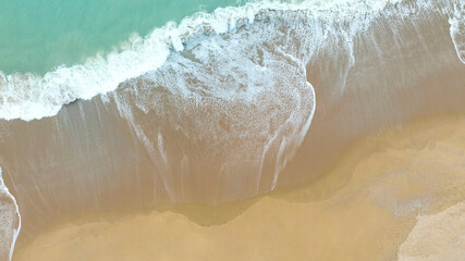 Aerial view of Summer seascape with beach waves from aerial  Top view from drone. Travel concept and idea