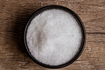 monosodium glutamate in a black cup